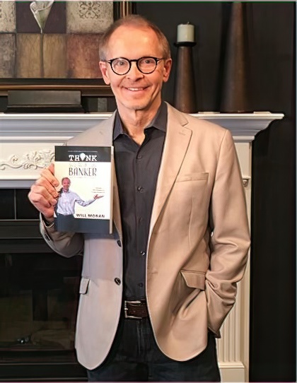 Will Moran holding Think Like A Banker book